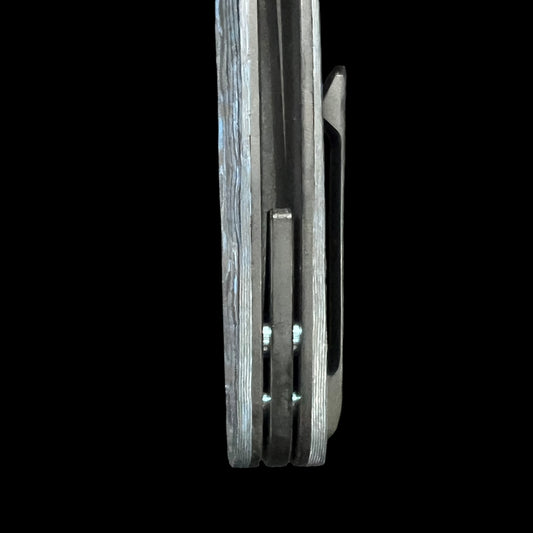 BEANS BLADES Javelin M390 Black PVD Drop Point, Titanium Black PVD handles with Electric Blue Camo Carbon.