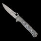 Spyderco/LionSTEEL Michele Pensato Slym Frame Lock Flipper Knife 3.42" M390 Stonewashed Drop Point Blade, Gray PVD Titanium Handles with Polar Dark Matter FatCarbon Inlay - C271TIP